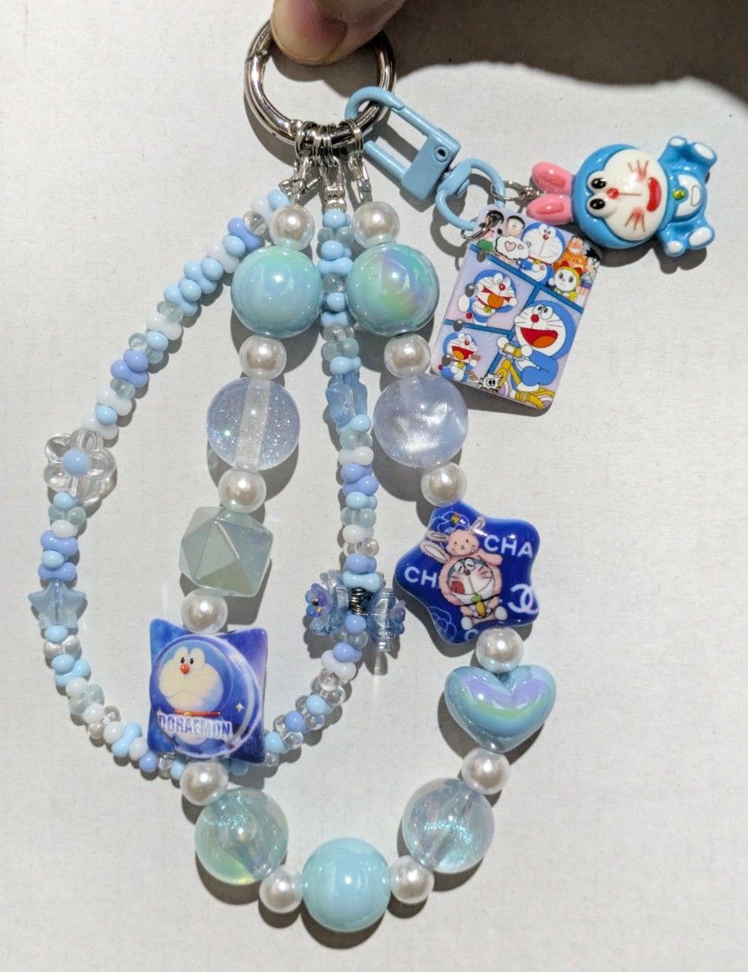 Handmade Doraemon Beaded Phone Charm Strap Bag Charm Keychain (Category: Character Goods) located in Batangas. Submitted by mirajane._ (Listing ID 1438875841, Image 1). Description: Doraemon Handmade Phone Charm, Bag Charm Accessory Anik-Anik - Brand new & handmade by me! ✨ - Hand crafted - Adorable Doraemon keychain - Comes with a clear phone lanyard tab - Perfect for bags and phones 🤍 MOP: GCash only MOD: J&T Pay as you order. No Reservations 