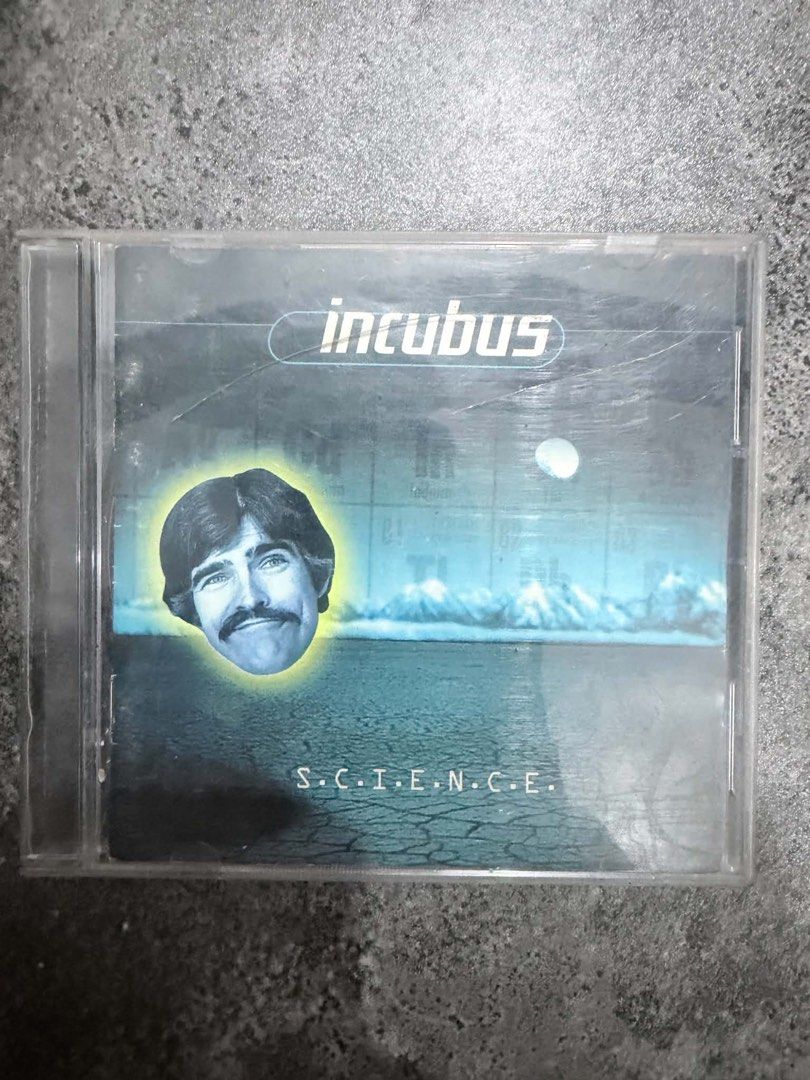 Incubus - S.C.I.E.N.C.E. CD (Category: CDs & DVDs) located in Makati City. Submitted by homme.boy.plus (Listing ID 1438838385, Image 1). Description: - Incubus' album S.C.I.E.N.C.E. CD - Features album cover art on the case - CD visible with tracklist printed on the disc - Includes a photo of the band members on the back of the case.
