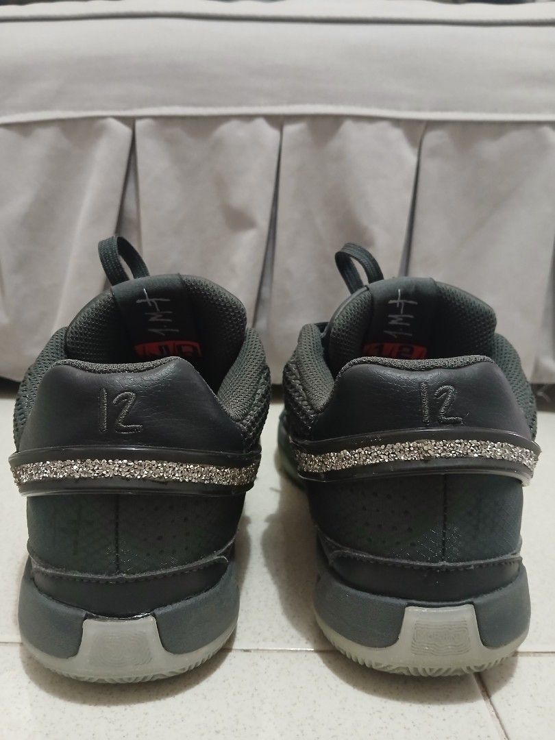 JA 1 "12 AM" Midnight Swarovski (Category: Sneakers) located in Manila. Submitted by isstation.3023 (Listing ID 1438822950, Image 3). Description: Complete details like: ✅️ • Tag on the toe box ✅️ • 1MT sign on the sides ✅️ • "Ja Morant" at the back ✅️ • 12AM chains on laces (complete) ✅️ • " Its 12AM Somewhere" text on the outsole ISSUE: No Box.