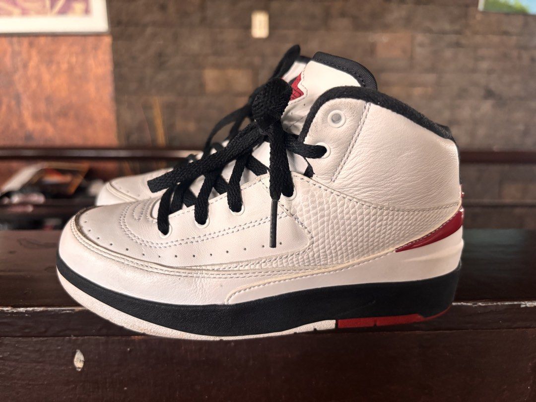 Jordan 2 Retro PS White Black Red 1Y (Category: Babies & Kids Fashion) located in Manila. Submitted by loopbabies (Listing ID 1438807141, Image 2). Description: - Air Jordan 2 Retro - Color: White, Black, Red - Features Air Jordan logo and Nike branding - Size: US 1Y - Leather upper.