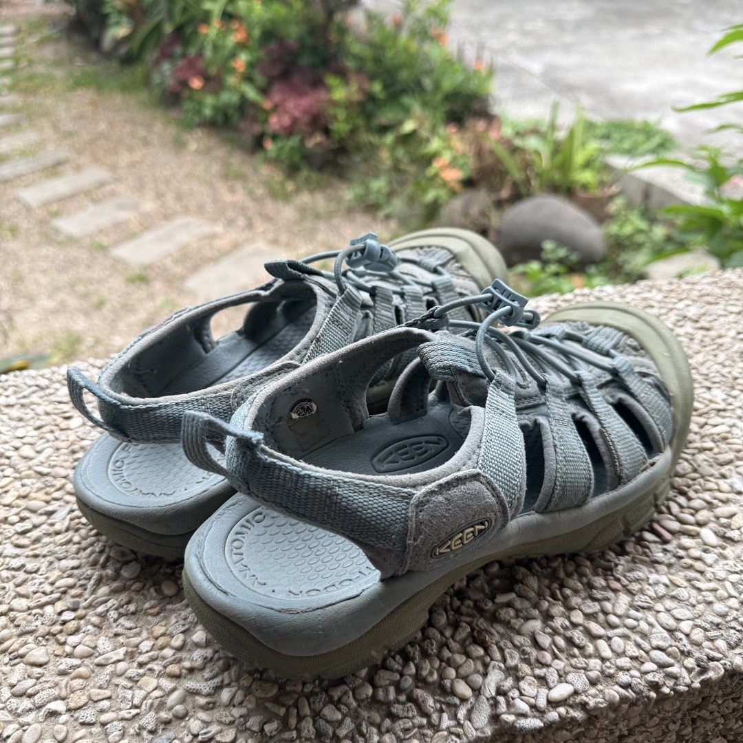 Keen Newport H2 Sandals (Category: Sandals) located in Los Banos. Submitted by mercadoina (Listing ID 1438698981, Image 2). Description: - Keen Newport H2 sandals - Color: Grey-green - Closed-toe design - Adjustable bungee lacing - Shows some wear on soles - Overall structure intact - Keen logo present - Perfect for outdoor activities.