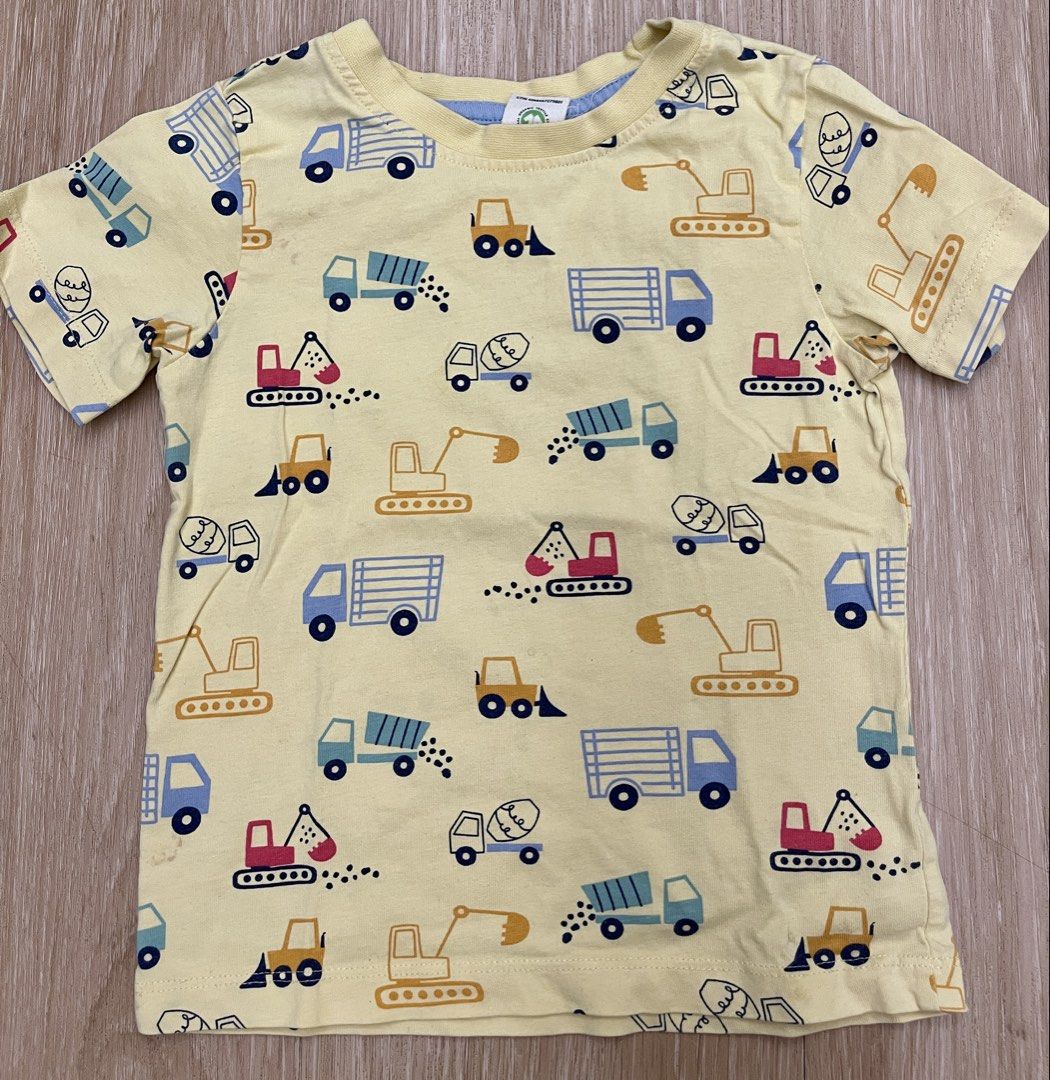 Kids Construction Print T-shirt (Category: Babies & Kids Fashion) located in Makati City. Submitted by riz.gspr (Listing ID 1438763194, Image 1). Description: - Yellow t-shirt - Features a fun construction vehicle print - Short sleeves - Round neckline - Made of soft, breathable fabric - Print includes trucks, excavators, and cement mixers - Great for young children.