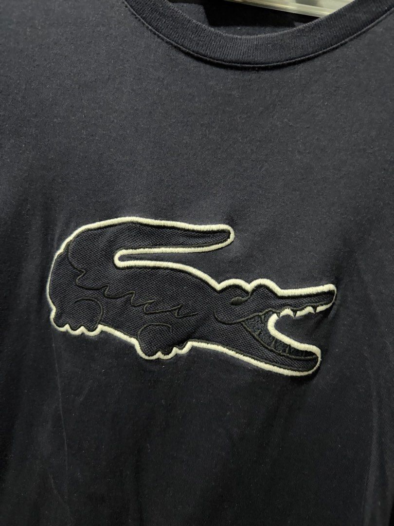 Lacoste Slim Fit T-shirt - US XL (Category: Tshirts & Polo Shirts ) located in Pasig City. Submitted by inmyclosetbyj (Listing ID 1438836065, Image 3). Description: - Lacoste Slim Fit T-shirt - Color: Navy Blue - Size: US XL - Iconic crocodile logo with white outline - Crew neck - Short sleeves - Tag visible in photos.