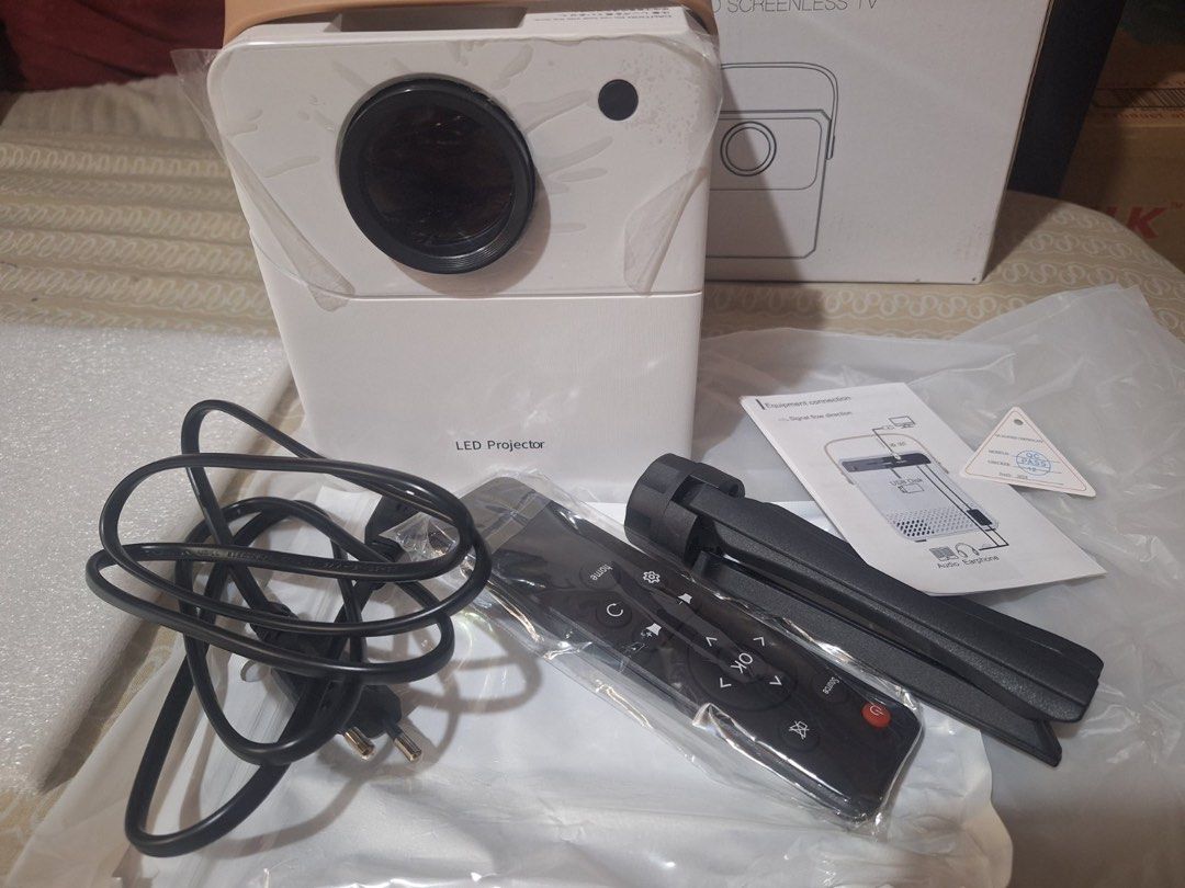 Smart Mini Portable 4K LED Projector WiFi & Bluetooth Compatible (Category: Projectors) located in Quezon City. Submitted by miguel010826 (Listing ID 1438759702, Image 2). Description: - Compact 4K LED projector - crisp image quality with high brightness for both day and night use -Includes Netflix, YouTube, etc (no membership) -Supports multiple connections - TF Card, USB, HDMI for flexible usage -WiFi and Bluetooth compatible -Includes Focus Ad