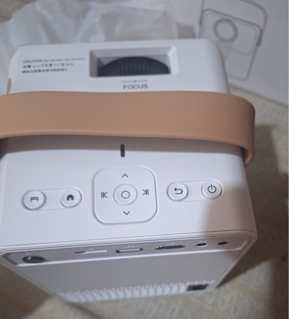 Smart Mini Portable 4K LED Projector WiFi & Bluetooth Compatible (Category: Projectors) located in Quezon City. Submitted by miguel010826 (Listing ID 1438759702, Image 3). Description: - Compact 4K LED projector - crisp image quality with high brightness for both day and night use -Includes Netflix, YouTube, etc (no membership) -Supports multiple connections - TF Card, USB, HDMI for flexible usage -WiFi and Bluetooth compatible -Includes Focus Ad