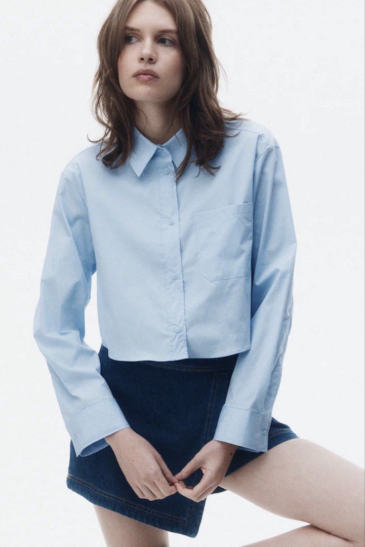 H&M Light Blue Cropped Shirt (Category: Shirts) located in Manila. Submitted by chips22 (Listing ID 1438735572, Image 1). Description: - Light blue shirt - Classic collar - Single chest pocket - Long sleeves with buttoned cuffs - Cropped hem - Lightweight fabric.