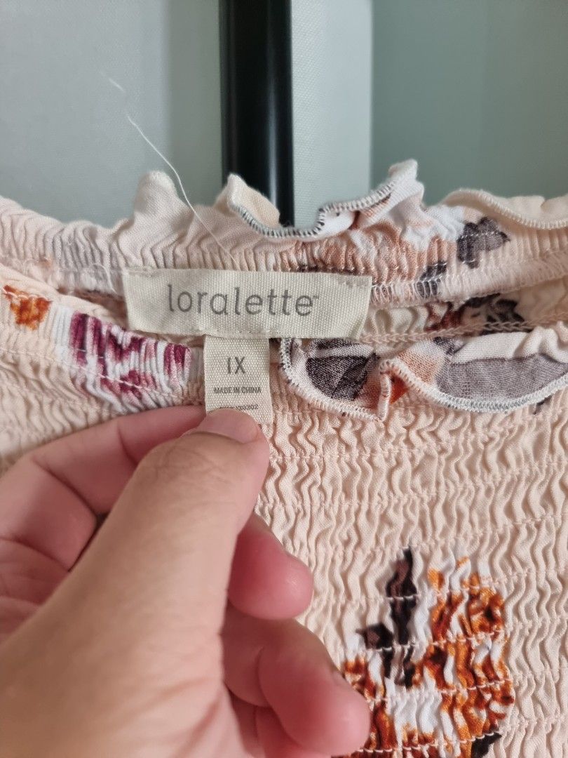 Loralette Floral Top 1X (Category: Sleeveless) located in Santa Rosa. Submitted by grace116 (Listing ID 1438723161, Image 2). Description: - Brand: Loralette - Size: 1X - Design: Floral print - Details: Smocked bodice, ruffled edges - Colors: Light background with brown, purple, and orange floral accents - soft and stretchy bust max stretch 23 inches length 22 inches loc: sta rosa, laguna.