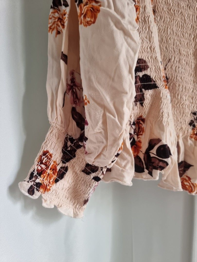 Loralette Floral Top 1X (Category: Sleeveless) located in Santa Rosa. Submitted by grace116 (Listing ID 1438723161, Image 3). Description: - Brand: Loralette - Size: 1X - Design: Floral print - Details: Smocked bodice, ruffled edges - Colors: Light background with brown, purple, and orange floral accents - soft and stretchy bust max stretch 23 inches length 22 inches loc: sta rosa, laguna.