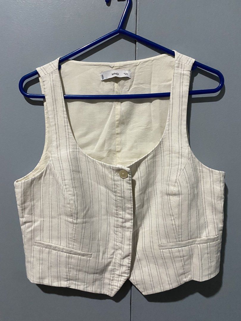 Mango Striped Vest - Size L (Category: Sleeveless) located in Mandaluyong City. Submitted by _adjh (Listing ID 1438874051, Image 1). Description: - Mango striped vest - Size: L - Features: Single-button closure, two front pockets - Fit: Tailored - Neckline: Scoop - Color: Neutral.