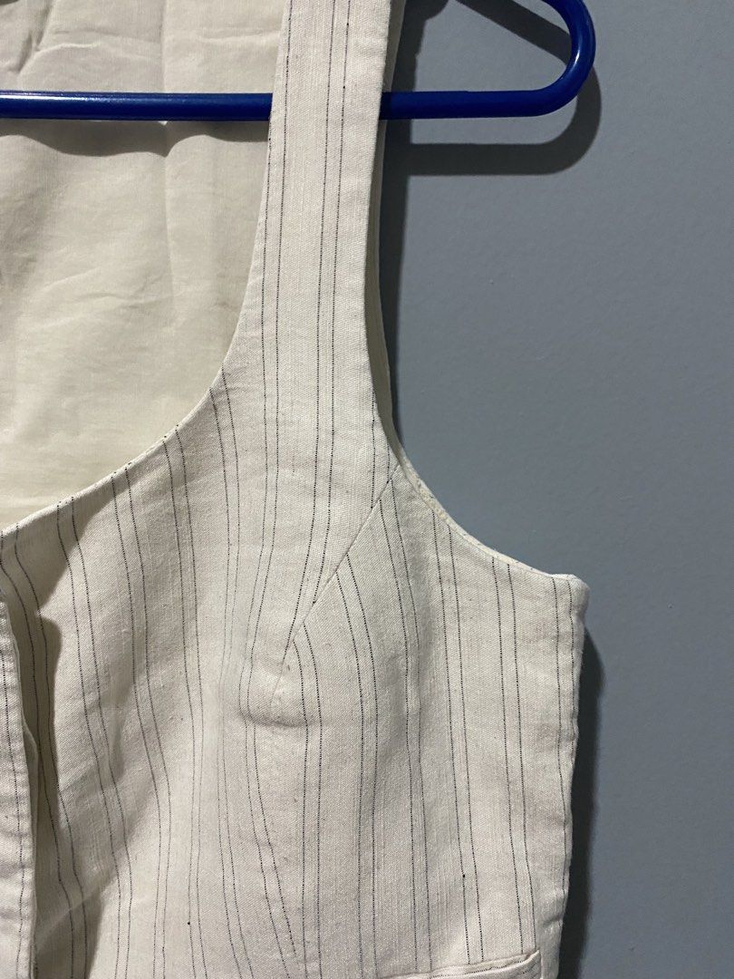 Mango Striped Vest - Size L (Category: Sleeveless) located in Mandaluyong City. Submitted by _adjh (Listing ID 1438874051, Image 3). Description: - Mango striped vest - Size: L - Features: Single-button closure, two front pockets - Fit: Tailored - Neckline: Scoop - Color: Neutral.