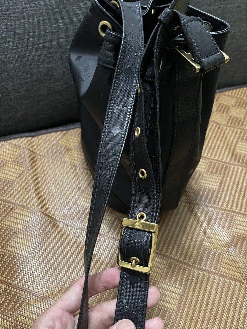 MCM Black Bucket Bag (Category: Luxury Bags & Wallets) located in Valenzuela. Submitted by bekikemper (Listing ID 1438733555, Image 2). Description: - Authentic MCM bucket bag - Black color - Drawstring closure - Gold-tone metal logo plate and hardware - Detachable shoulder strap - Interior zippered pocket - MCM logo lining - Includes lock and key -Bought sa Japan. NOTE: WALA PONG BOX AT DUST BAG ITONG BAG. Rush lang po for my mom’s chemo meds. S