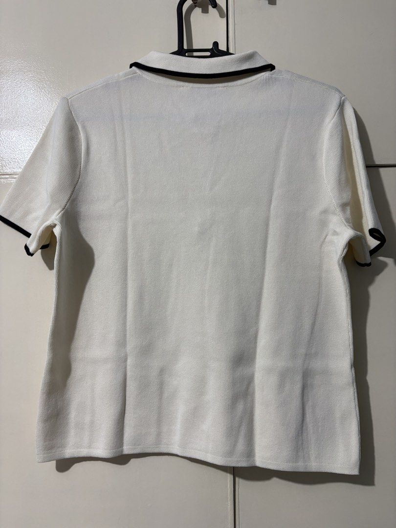 Memo White Polo Top with Black Trim Large (Category: Blouses) located in Caloocan City. Submitted by mommyk2026 (Listing ID 1438786473, Image 3). Description: Memo White Polo Top with Black Trim Large Polo shirt / blouse Collared neckline, zipper closure, short sleeves Knitted Office / Casual / Semi-formal / Business Attire Preloved, used 3x only Negotiable RFS: Decluttering Payment via Gcash/ Online bank transfer Shipped from South Caloocan Ship