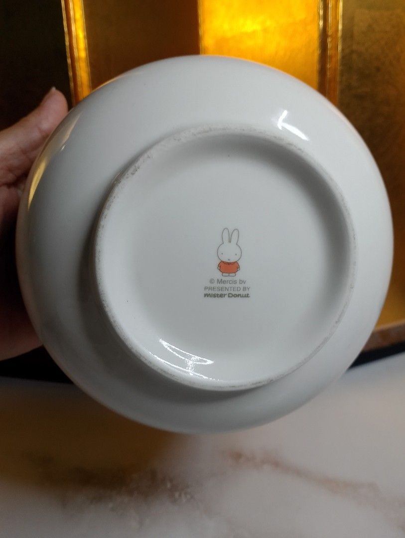 Miffy x Misdo Ceramic Bowl (Category: Other Kitchenware & Tableware) located in Valenzuela. Submitted by buylaaaaa (Listing ID 1438785222, Image 3). Description: - Miffy x Misdo ceramic bowl - Features a white exterior with Miffy illustration, clover, and a quote - Bottom marked with Miffy logo and "Produced by Mister Donut" - Approximately 10cm diameter - Approximately 7cm height.