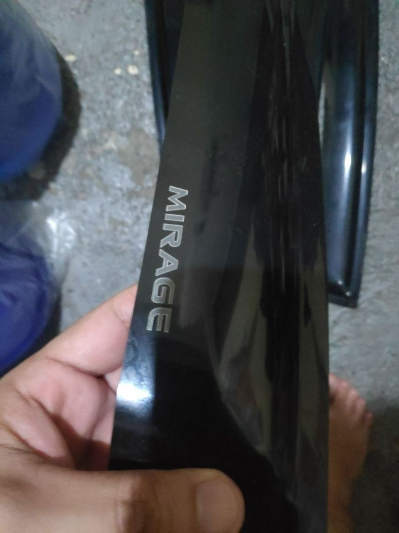 Mitsubishi Mirage Window Visor for Hatchback (Category: Body Parts and Accessories) located in Angeles City. Submitted by ben91wallace (Listing ID 1438799055, Image 1). Description: For sale, Rain Visor for Mirage Hatchback Price: 300 only No to swap Pm nalang Location: Fiesta Mining Pandan - Window visors for Mitsubishi Mirage - Deflects rain and wind - Allows ventilation in all weather - Made of durable black plastic - Custom fit for Mirage win