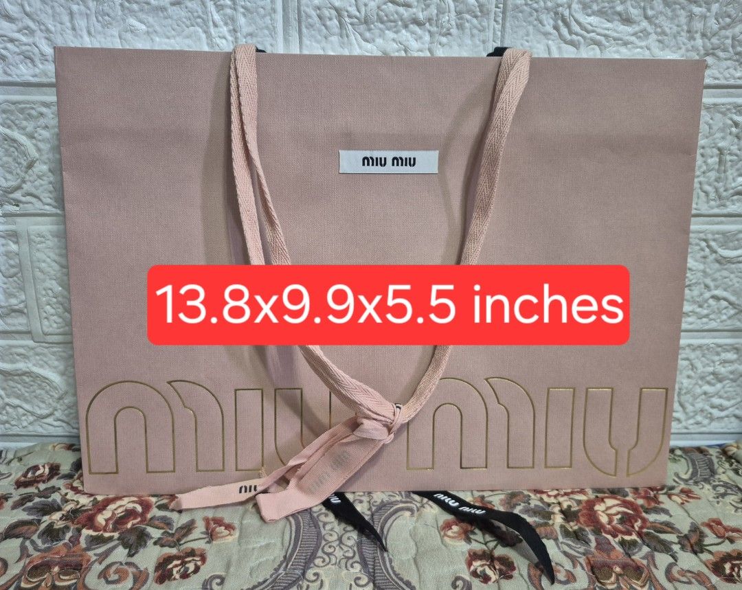 Miu Miu Paper Bag with ribbon (Category: Luxury Accessories) located in Pasig City. Submitted by luxbox_acc (Listing ID 1438696438, Image 2). Description: Large rose pink- 800 medium rose pink-650 SOLD medium white-650 I have card holder/envelope for sale also.