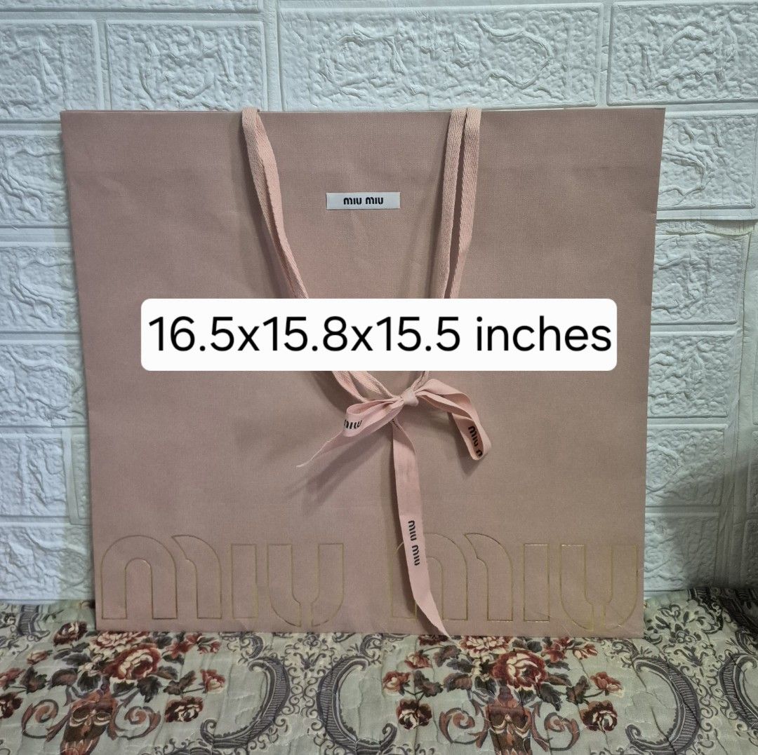 Miu Miu Paper Bag with ribbon (Category: Luxury Accessories) located in Pasig City. Submitted by luxbox_acc (Listing ID 1438696438, Image 1). Description: Large rose pink- 800 medium rose pink-650 SOLD medium white-650 I have card holder/envelope for sale also.