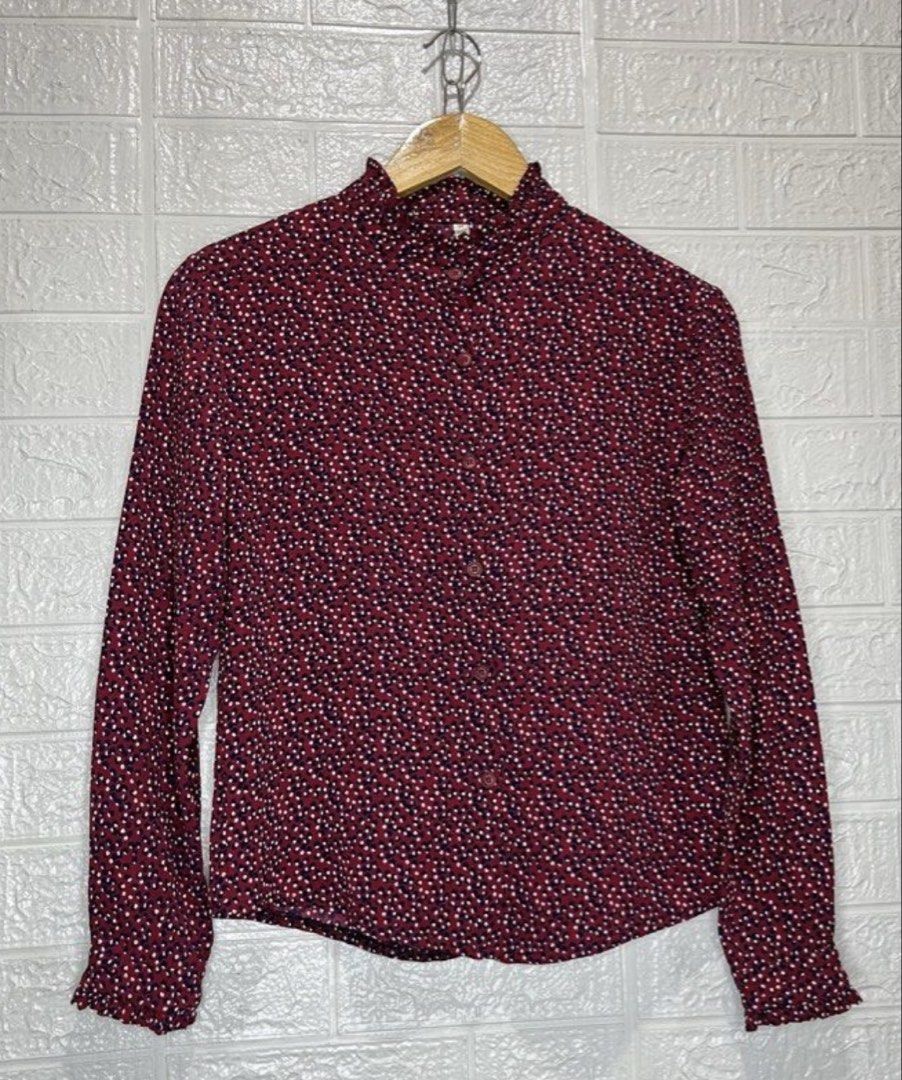 N.H. Floral Blouse - Size M (Category: Blouses) located in Malabon City. Submitted by igigs (Listing ID 1438757580, Image 1). Description: - Brand: N.H - Color: Maroon with floral pattern - Features: Long sleeves with ruffled cuffs, high neckline with ruffle detail, button-down front - Size: M.