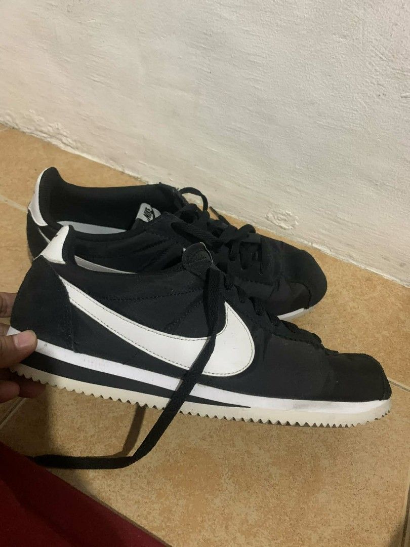 Nike Cortez Black and White (Category: Sneakers) located in Manila. Submitted by itsurpaul. (Listing ID 1438808795, Image 1). Description: - Classic Nike Cortez - Black upper with white accents - White sole - Iconic Nike swoosh - Nike logo on heel and insole - Some sole wear - Includes original laces - Size 9.5uk.