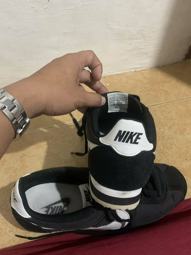 Nike Cortez Black and White (Category: Sneakers) located in Manila. Submitted by itsurpaul. (Listing ID 1438808795, Image 2). Description: - Classic Nike Cortez - Black upper with white accents - White sole - Iconic Nike swoosh - Nike logo on heel and insole - Some sole wear - Includes original laces - Size 9.5uk.