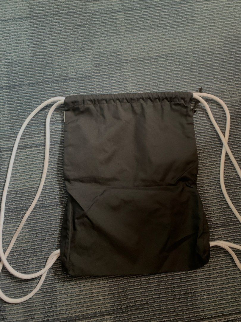 Nike Drawstring Bag (Category: Backpacks) located in Pasay City. Submitted by Oboyyy (Listing ID 1438746426, Image 3). Description: - Black Nike drawstring bag - Features a large white Nike logo - White drawstring straps - Made of durable polyester - Made in China Used no issue 590 pesos.