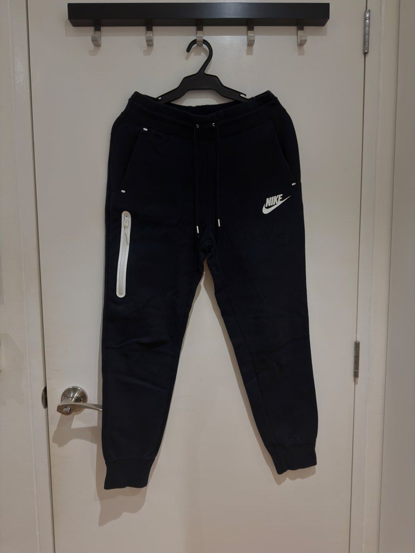 Nike Tech Fleece Joggers (Category: Joggers) located in Makati City. Submitted by delr2191 (Listing ID 1438743084, Image 1). Description: - Nike Tech Fleece pants - Color: Black - Size: Small (S) runs small - Features: White Nike logo, zippered side pocket, drawstring waistband - Made in Vietnam Used lightly.