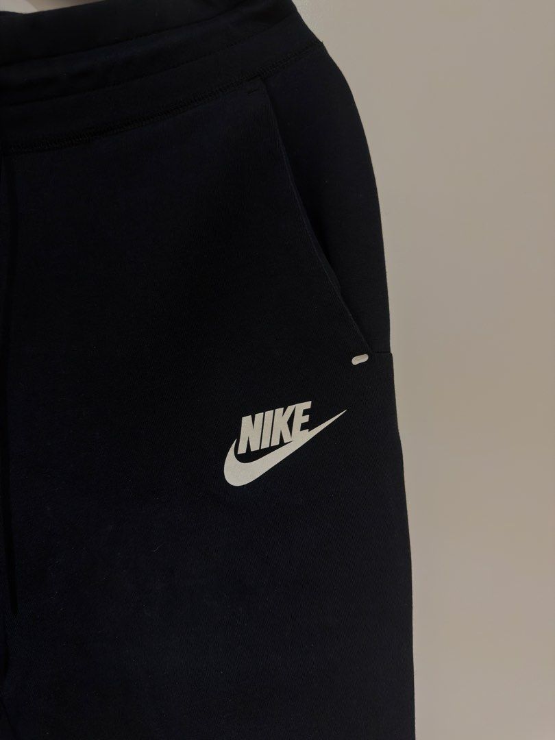 Nike Tech Fleece Joggers (Category: Joggers) located in Makati City. Submitted by delr2191 (Listing ID 1438743084, Image 2). Description: - Nike Tech Fleece pants - Color: Black - Size: Small (S) runs small - Features: White Nike logo, zippered side pocket, drawstring waistband - Made in Vietnam Used lightly.
