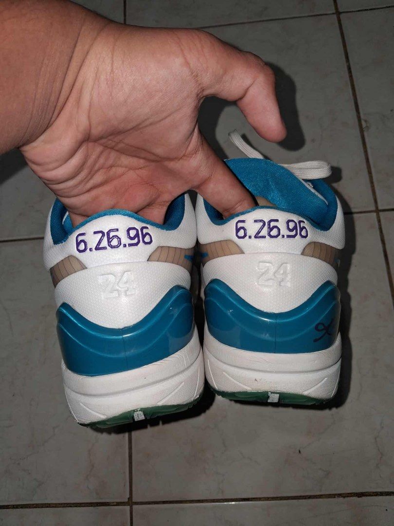 Nike Zoom Kobe IV 4 Draft Day Hornets (Category: Sneakers) located in Manila. Submitted by adoboaddict362 (Listing ID 1438825439, Image 1). Description: - Nike Zoom Kobe IV 4 sneakers - Color scheme: White, teal, and purple - Details on the back: "6.26.96" and "24" - Purple Nike Swoosh No Original Laces And No Original Box .