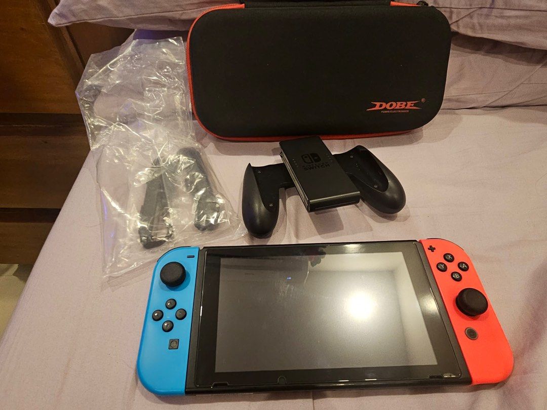 Nintendo Switch Console with Accessories (Category: Nintendo) located in Quezon City. Submitted by pafey (Listing ID 1438827206, Image 3). Description: Nintendo switch 1, May case n tempered, memory card na, slight damage/little dents on the side pero di nman halata, dm for more info, buyer will shoulder sf Will come with freebies Rfs: need of funds.