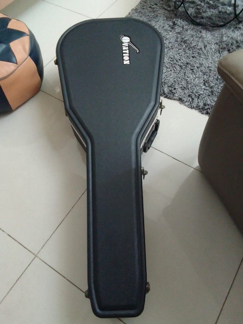 OVATION Guitar with Hard Case (Category: Musical Instruments) located in Manila. Submitted by noblewhale_5aa785 (Listing ID 1438756231, Image 2). Description: - Ovation acoustic-electric guitar - Striking red and black finish - Includes a hard case for protection - Unique body shape with sound holes on the upper bout - Classic headstock design - Ovation-branded hard case.