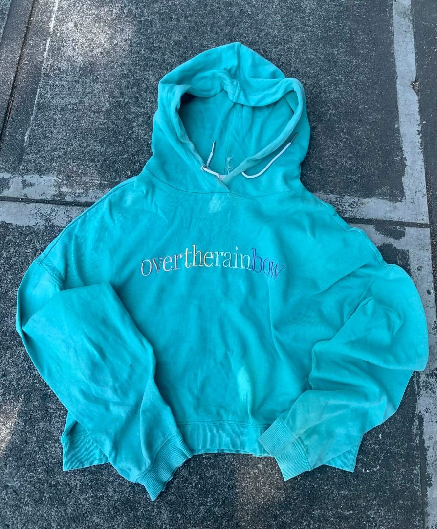 Over the Rainbow Embroidered Hoodie (Category: Coats, Jackets and Outerwear) located in San Pedro. Submitted by hoodloopxnoel (Listing ID 1438789986, Image 1). Description: - Turquoise cropped hoodie - "Over the Rainbow" embroidered design - Soft and comfortable fabric - Drawstring hood - Ribbed cuffs - Ideal for casual wear.