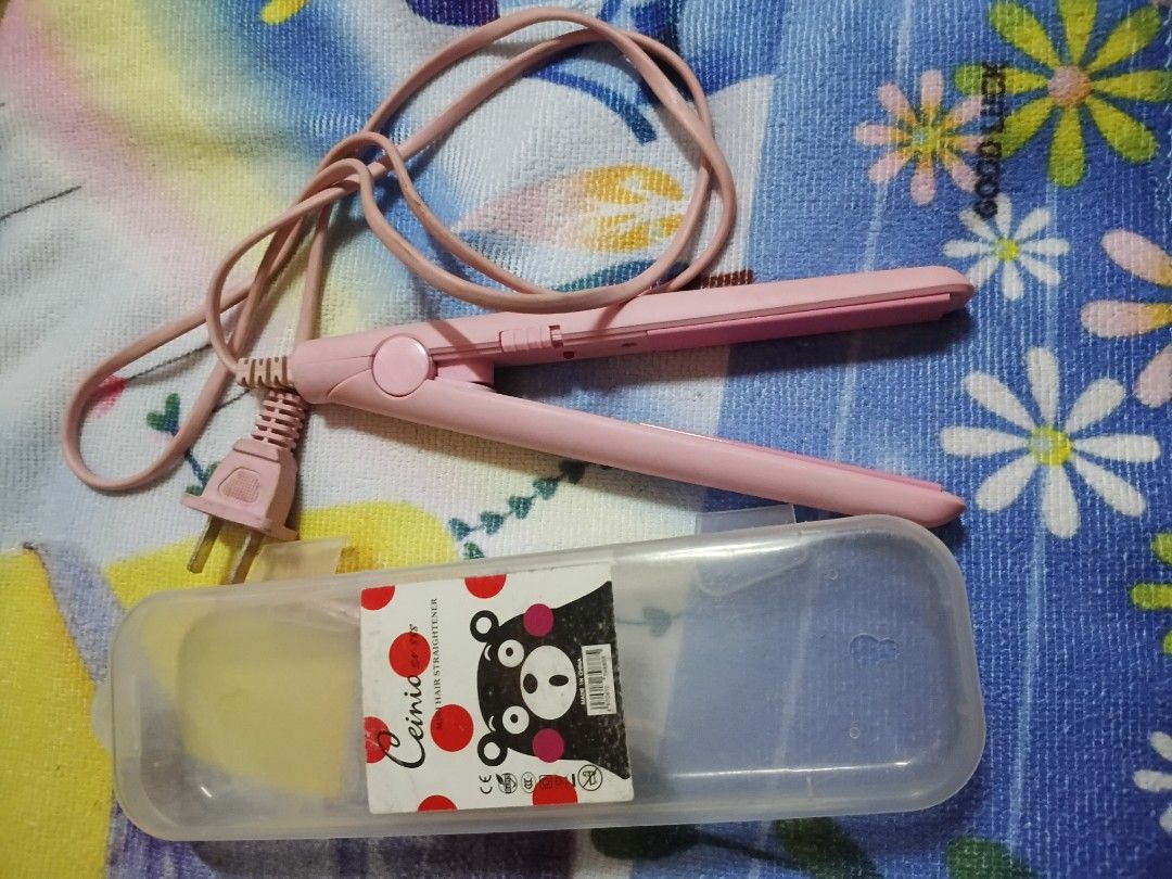Pink Mini Hair Straightener with Case (Category: Hair) located in Quezon City. Submitted by xorei (Listing ID 1438719209, Image 1). Description: - Pink hair straightener - Matching pink cord - Clear plastic storage case included - Simple, single-button design - Two-prong plug - Ready to use.