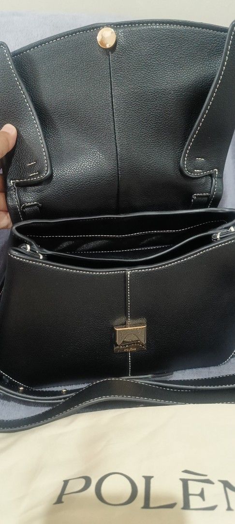 Polène Black Handbag (Category: Luxury Bags & Wallets) located in Santa Rosa. Submitted by me.dscluter (Listing ID 1438727602, Image 3). Description: - Black Polène handbag - Top handle and detachable shoulder strap - Flap closure - Multiple interior compartments - Includes dust bag - Made in Spain.
