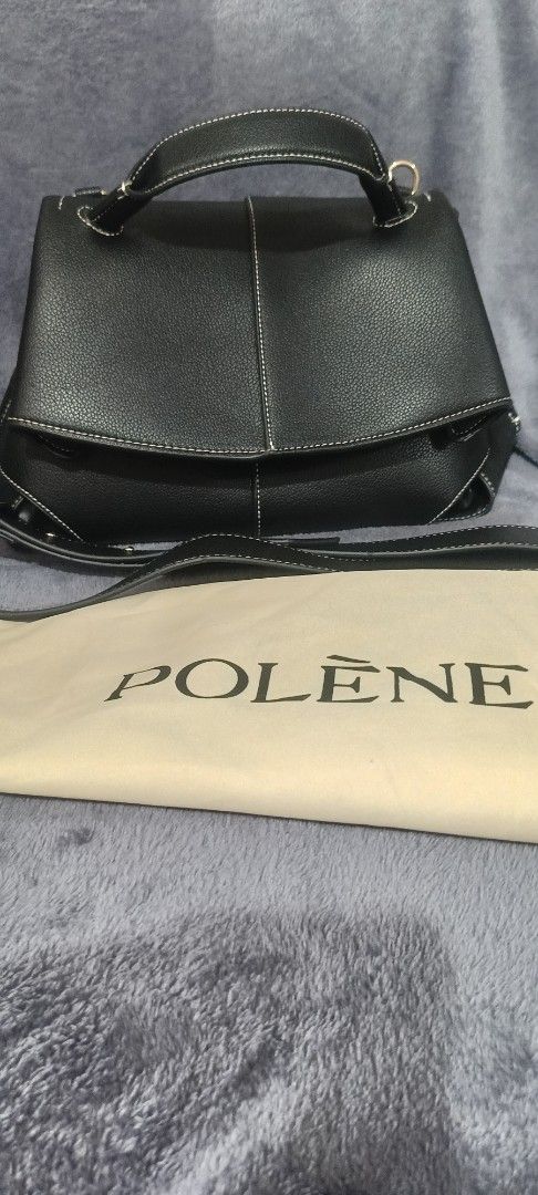 Polène Black Handbag (Category: Luxury Bags & Wallets) located in Santa Rosa. Submitted by me.dscluter (Listing ID 1438727602, Image 1). Description: - Black Polène handbag - Top handle and detachable shoulder strap - Flap closure - Multiple interior compartments - Includes dust bag - Made in Spain.