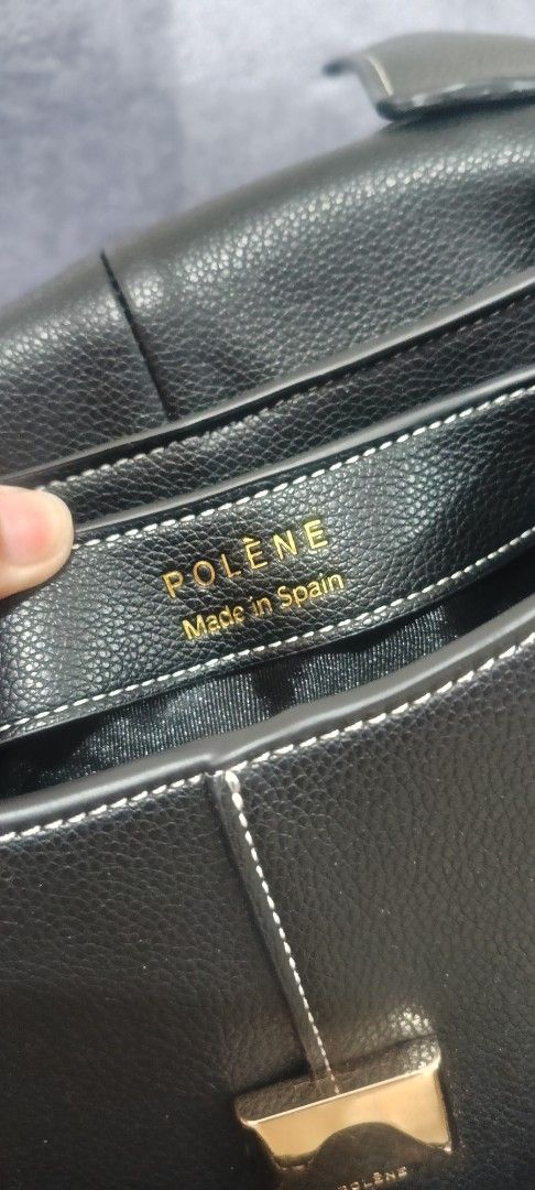 Polène Black Handbag (Category: Luxury Bags & Wallets) located in Santa Rosa. Submitted by me.dscluter (Listing ID 1438727602, Image 2). Description: - Black Polène handbag - Top handle and detachable shoulder strap - Flap closure - Multiple interior compartments - Includes dust bag - Made in Spain.