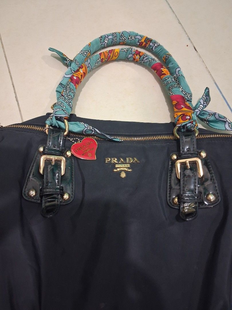 Prada hand bag (Category: Luxury Bags & Wallets) located in Manila. Submitted by carlitoboh66625 (Listing ID 1438732070, Image 1). Description: prada hand bag all details declare width 14 length 11 hem 7 missing sling belt price 500.