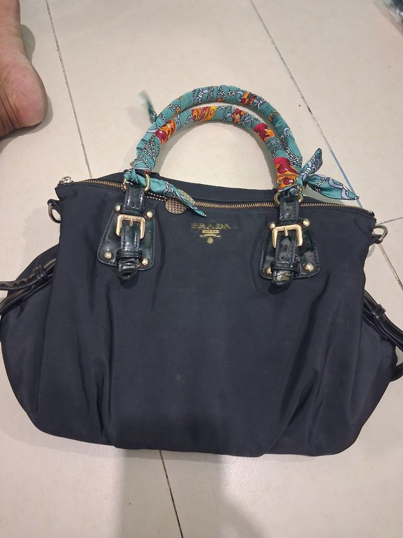 Prada hand bag (Category: Luxury Bags & Wallets) located in Manila. Submitted by carlitoboh66625 (Listing ID 1438732070, Image 3). Description: prada hand bag all details declare width 14 length 11 hem 7 missing sling belt price 500.