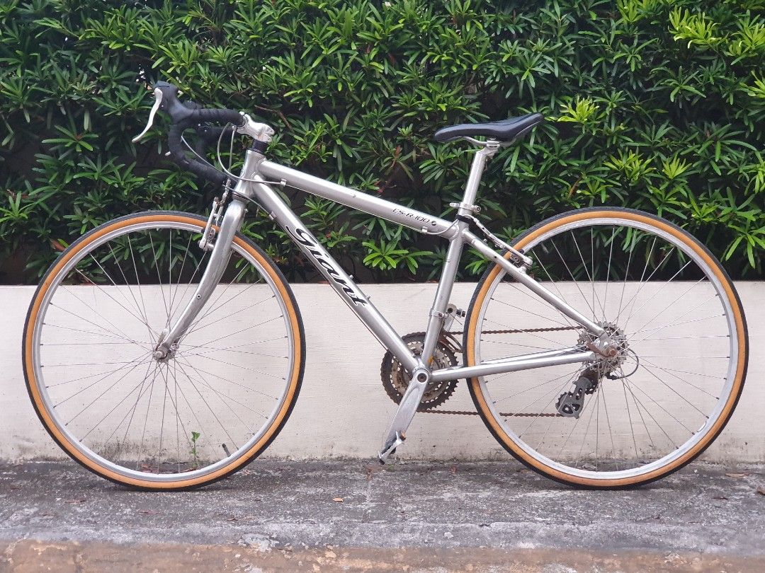 Rare Retro GIANT CS-R100 700c (Category: Bicycles) located in Las Pinas. Submitted by oldsthetics (Listing ID 1436649573, Image 1). Description: Something retro for a project bike? Test ride and negotiate Letting go of this Rare Retro GIANT CS-R100 On it's Old Retro Giant Logo 700c Aluxx frame SS 43 / TT 53 Shimano Sora Flightdeck Shimano Acera 3x8 Tektro Travel Agent V-brakes Need to refresh/restore Running condition Lost time to use it regularl