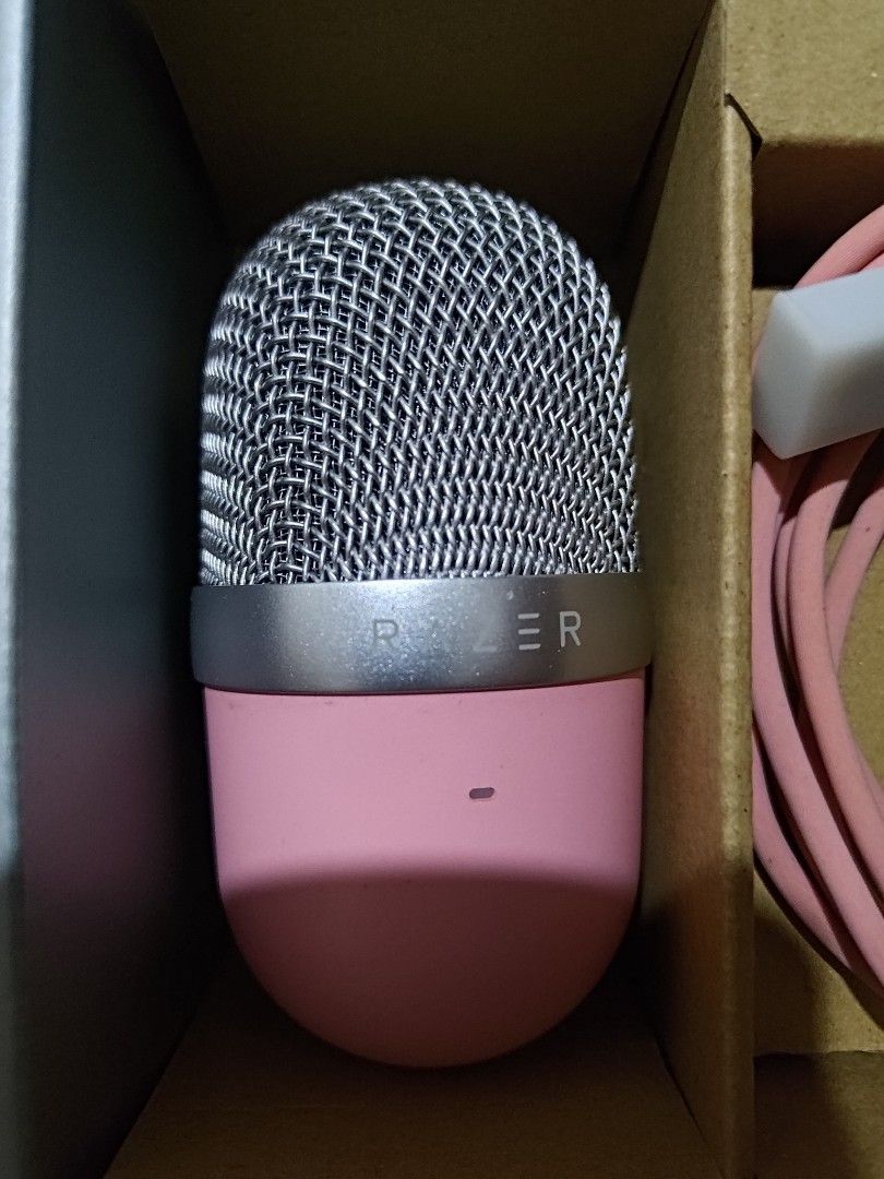 Razer Seiren Mini USB Microphone - Pink (Category: Microphones) located in Manila. Submitted by ayasellss85933 (Listing ID 1438826572, Image 2). Description: - Razer Seiren Mini USB microphone (Pink) - Includes microphone, pink USB cable, and original packaging - Silver mesh head with pink body - Designed for streaming and recording - Used for about 1-2 years estimate, then changed to a different microphone more suitable for broadcasting. - Comes