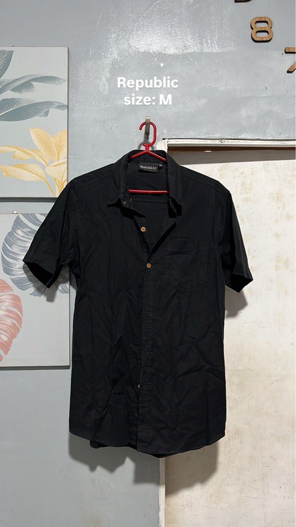 Republic Short Sleeve Shirt (Category: Tshirts & Polo Shirts ) located in Taguig. Submitted by ls_ln (Listing ID 1438777095, Image 1). Description: - Republic black short sleeve shirt - Size: M - Features: Button-down front, chest pocket, collared neckline - Style: Versatile - can be dressed up or down - Perfect for casual and semi-formal occasions.