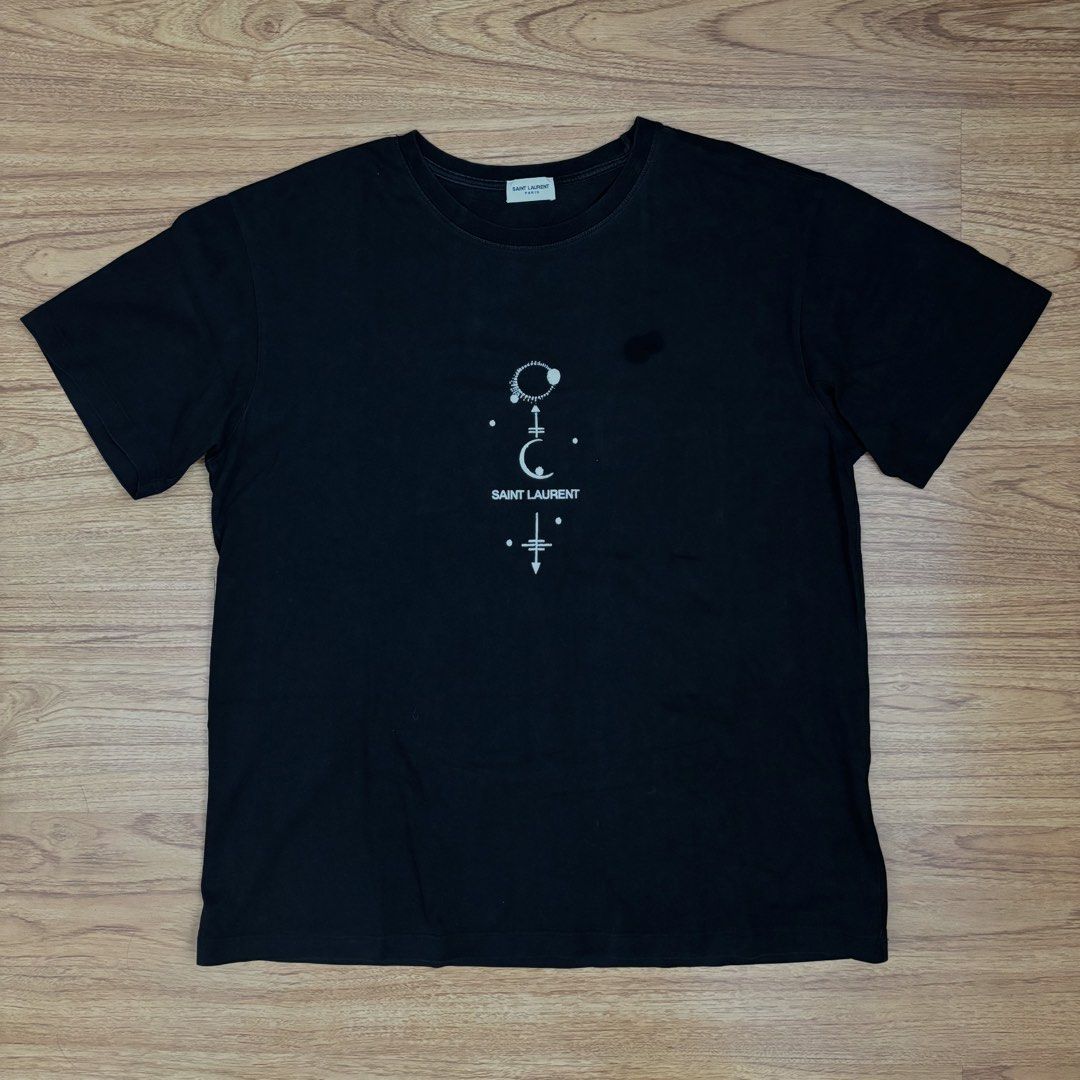 Saint Laurent Black Mystic Logo Tee (Category: Tshirts & Polo Shirts ) located in Taguig. Submitted by mariow (Listing ID 1438792958, Image 2). Description: Thrifted, source unknown 21 in x 26 in - Black Saint Laurent T-shirt - Graphic print on front - Crew neck - Short sleeves - Made in Italy.