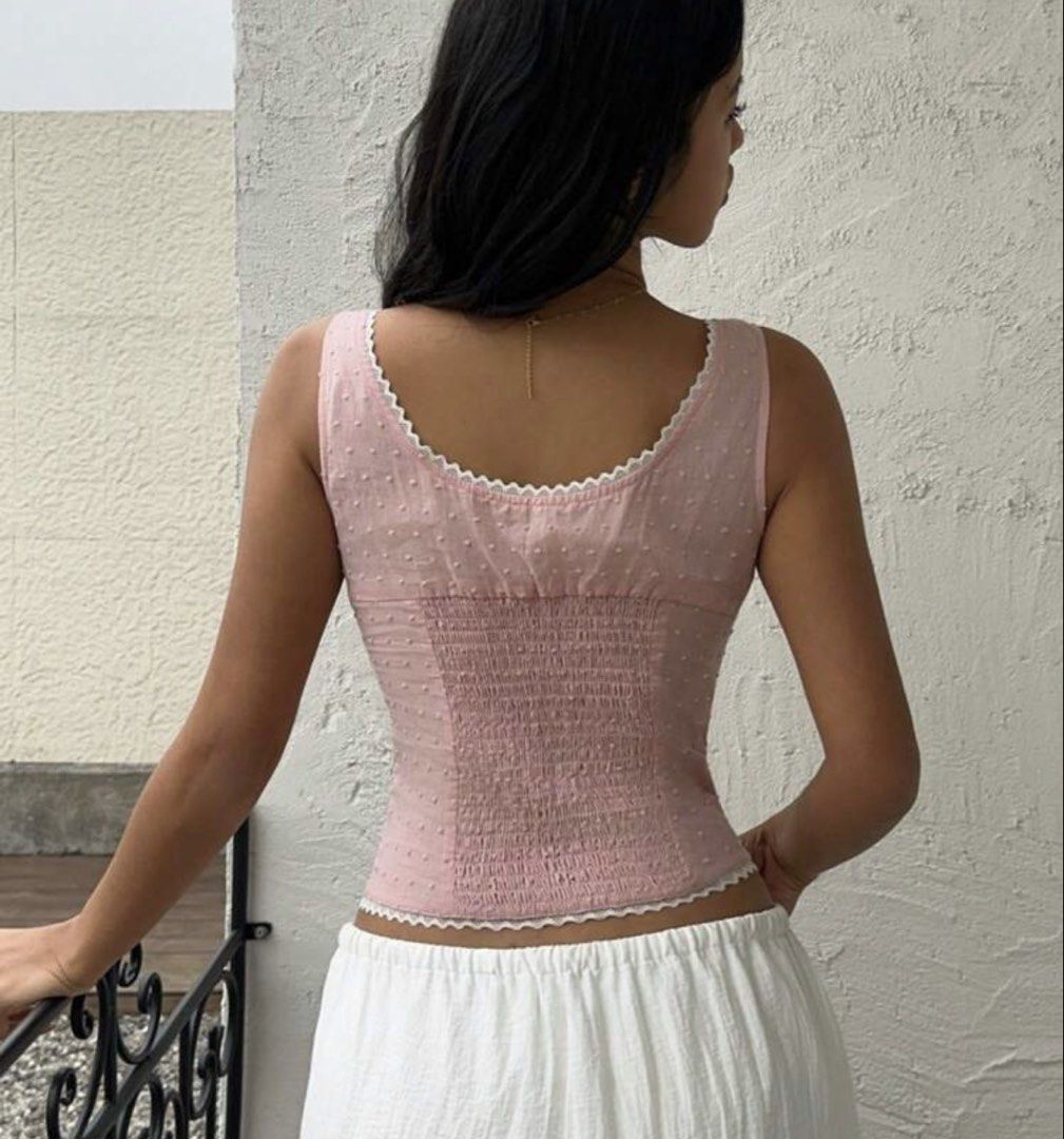 SHEIN Pink Lace Trimmed Top (Category: Sleeveless) located in Quezon City. Submitted by biuesides (Listing ID 1438804180, Image 2). Description: - Pink top with lace trim - Size S - Button-up front - Fitted silhouette with shirred back - Soft, breathable 100% cotton - Ideal for warm weather.