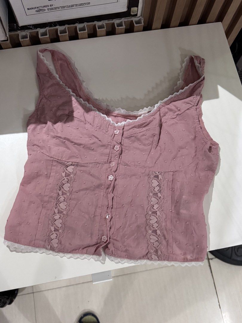 SHEIN Pink Lace Trimmed Top (Category: Sleeveless) located in Quezon City. Submitted by biuesides (Listing ID 1438804180, Image 3). Description: - Pink top with lace trim - Size S - Button-up front - Fitted silhouette with shirred back - Soft, breathable 100% cotton - Ideal for warm weather.