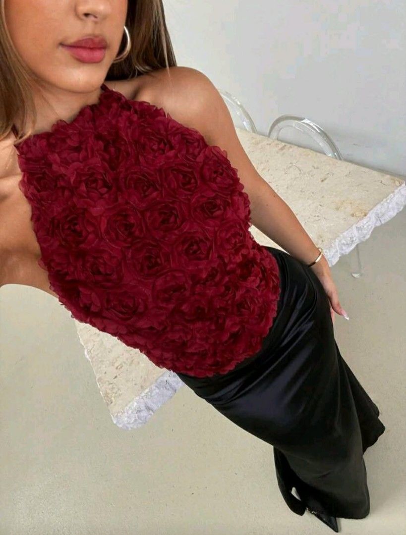 Shein Rose Halter Top (Category: Sleeveless) located in Caloocan City. Submitted by sydelacruz04048 (Listing ID 1438825040, Image 1). Description: Used once‼️ - Red halter top with a unique 3D rose design - Sleeveless - Halter neck style - Made of textured fabric - Versatile for various occasions.