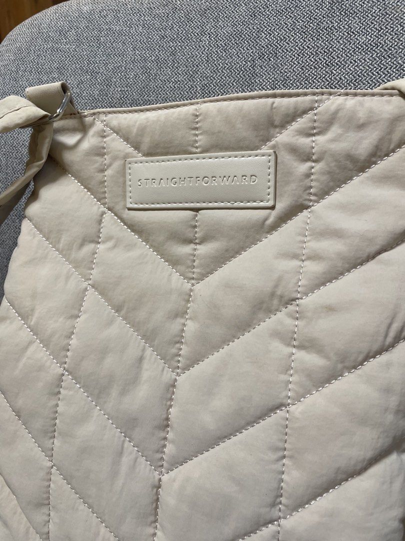 Straightforward Quilted Crossbody Bag (Category: Cross-body Bags) located in Quezon City. Submitted by mixeditemsforsale (Listing ID 1438801234, Image 2). Description: - Straightforward crossbody bag - Cream color - Quilted design - Rectangular shape - Magnetic closure - Shoulder strap - Interior pocket - Made of soft, padded material.
