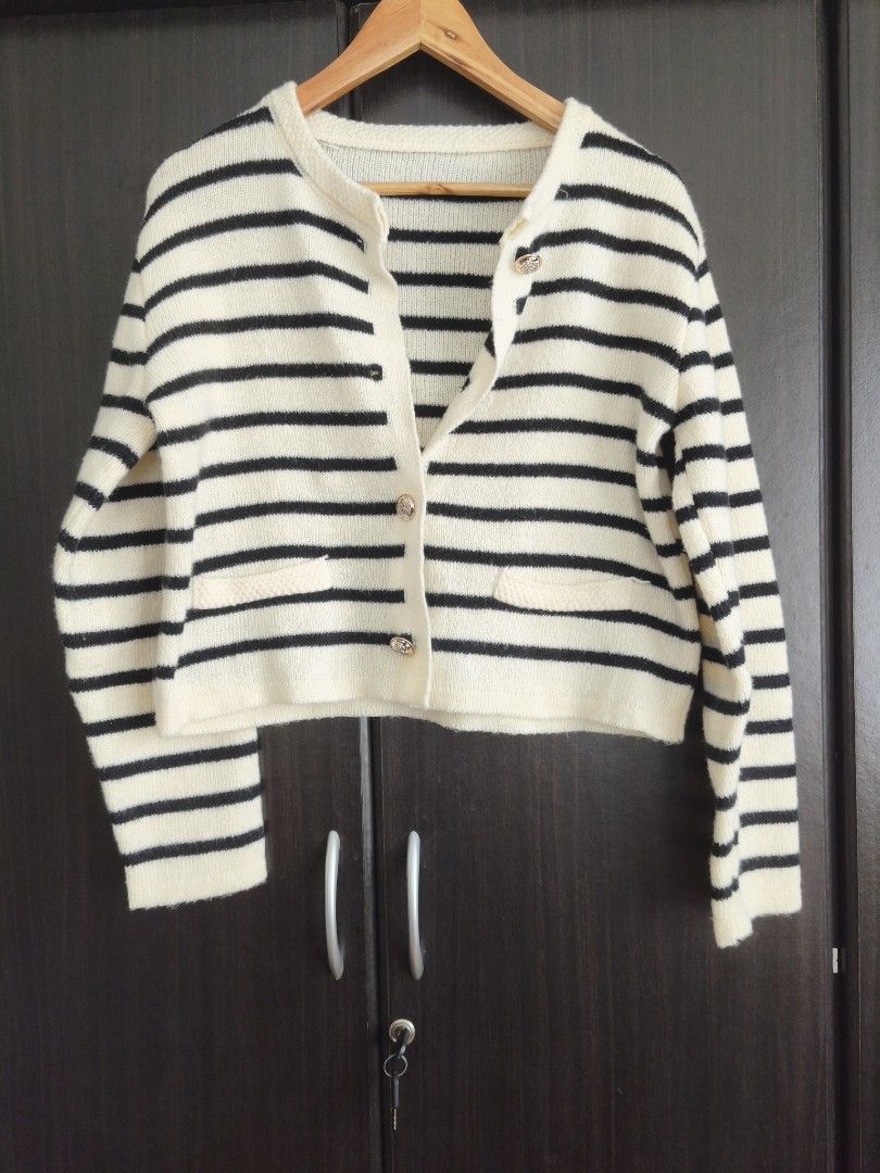 PRELOVED : Striped Knit Cardigan (L-XL) (Category: Coats, Jackets and Outerwear) located in Mariveles. Submitted by itsmemykabee (Listing ID 1438760314, Image 2). Description: A soft and cosy cream cardigan with classic black stripes and elegant button details. Perfect for layering over any outfit for a timeless, effortless look. In great condition and ideal for everyday wear ・✿Mode of Payment : Gcash ・✿Mode of Delivery : J&T book via an app (plu
