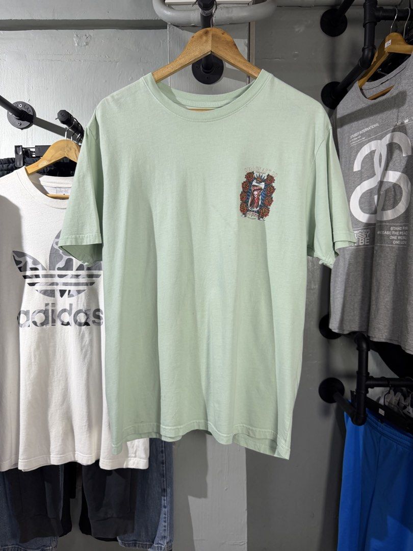 Sullen Art Co. Mint Green Graphic Tee (Category: Tshirts & Polo Shirts ) located in Calamba. Submitted by rummaged.ph (Listing ID 1438773725, Image 2). Description: MS349 Width: 21” Length: 28” Size: Large Issue/s: stains and hairline crack print Condition: 9/10 TAKE NOTE: 📌 Color may vary due to lighting. 📌 Manage your expectations, these items are thrifted. 📌 Want more detailed photos? Message US. 📌 No when-worn photos available. MS11.