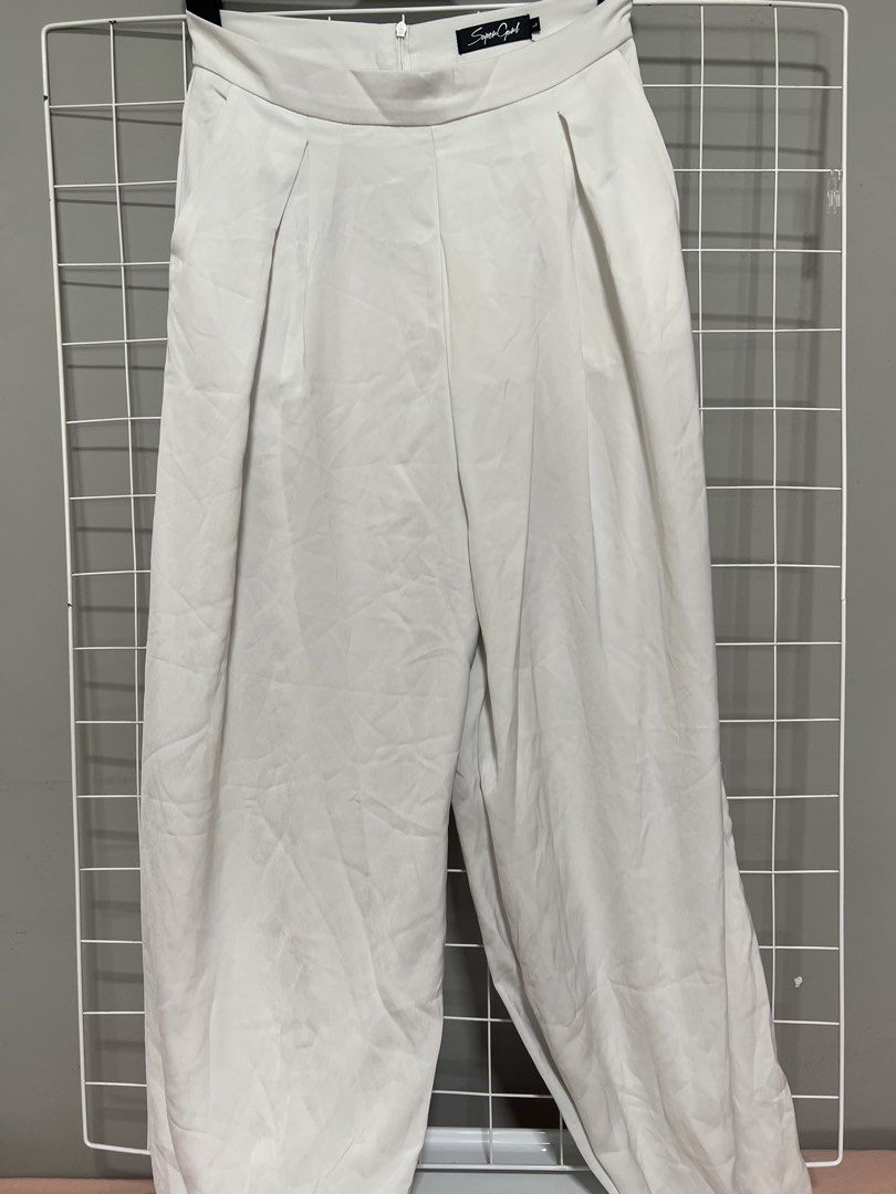 Supergurl White Wide Leg Pants (Category: Other Bottoms) located in Singapore. Submitted by stopmyshopaholictendencies (Listing ID 1438759101, Image 1). Description: Self collect at bukit batok hdb only Supergurl white wide-leg pants. High-waisted with front pleats. Size L. Chic and comfortable..