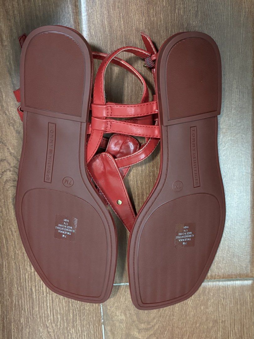 Tommy Hilfiger Jerika Red Thong Sandals (Category: Flats & Sandals) located in Cagayan de Oro. Submitted by cristine.s (Listing ID 1438708098, Image 3). Description: Red Tommy Hilfiger Thongs Sandals Model: Jerika Size: US 7 New from US retails $89 USD; never worn ❗️With flaw: Slight chipped off in the toe strap. See last photo posted. Not noticeable when worn. Design: T-strap with gold-tone logo Closure: Buckle for adjustable fit like zara mango