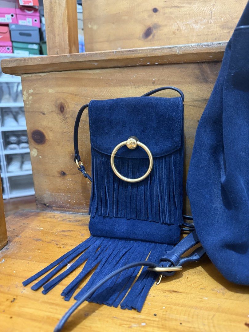 Tory Burch Bag Set (Category: Luxury Bags & Wallets) located in Baguio. Submitted by clemens031 (Listing ID 1438787175, Image 3). Description: - Navy blue backpack and crossbody bag set - Features a suede-like material - Gold-tone ring detail and tassel accents on both bags - Backpack: Flap closure and adjustable straps - Crossbody bag: Fringe detail.