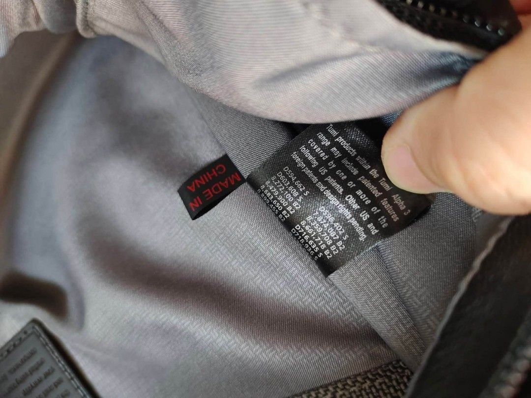 Tumi Alpha 2 Tote Bag (Category: Luxury Bags & Wallets) located in Cebu City. Submitted by tlisurplus (Listing ID 1438813897, Image 2). Description: - Black Tumi Alpha 2 tote bag - Main compartment with multiple pockets - Includes a detachable luggage tag - Features a top handle and a shoulder strap - Made in China - Gray interior lining.